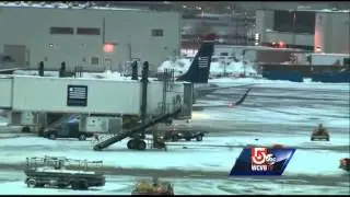 Plane hits deicing truck at Logan