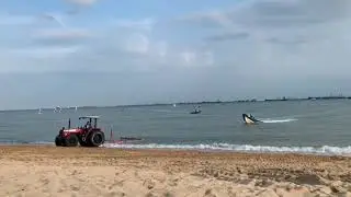 Tractor towing a boat
