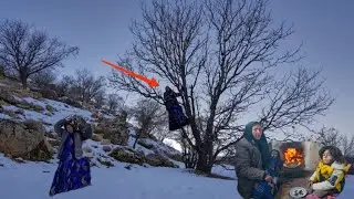 Grandma digs into the snowy mountains to provide wood for the winter.