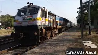 Kerala Sampark Kranti in ICF Day with WDP 4 Crossing Small Village in Gujarat.