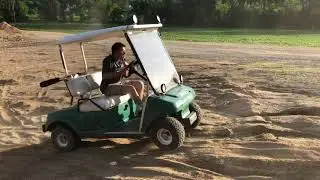 Golf carts in a sand pit