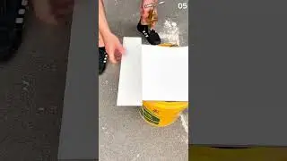 Scratching ceramic on a yellow bucket: a thin line is formed,
