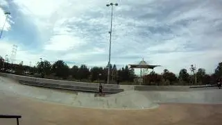 Longboarder Boardslides down 6 rail at SCV Skatepark