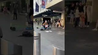 Piano artist playing piano at front of Melbourne central shopping centre