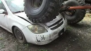 Chevy K20 on 44&rdquo; Ground Hawgs  picking on a junk Chevy Colbalt I couldn't help my self :)