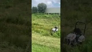 Bobcat AT450 in action with a 72&rdquo;  brush cutter mowing a retention pond. #power #mower #subscribe