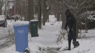 People in Lansing dig out of the snow after Friday night storm