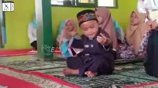 cute little boy enjoy dance in masjid