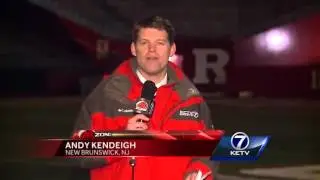 Game Ball: Andy Kendeigh hands out the game ball following Nebraska-Rutgers