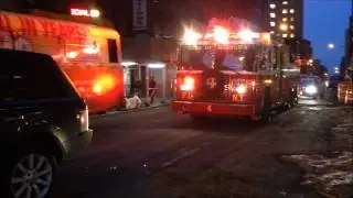 FDNY LADDER 4 RESPONDING IN HEAVY TRAFFIC ON W. 50TH ST. IN MIDTOWN, MANHATTAN IN NEW YORK CITY.
