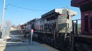 a westbound Autorack with a Kcs Grey ghost passing Elkhart station