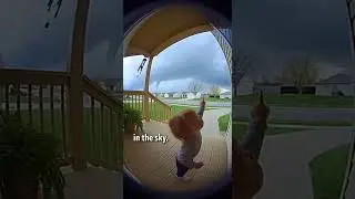 Baby Points at Forming Funnel Cloud