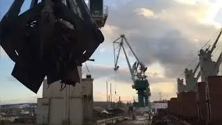 Export of scrap metal from Russia. Loading of a cargo ship at the seaport.