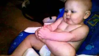 Logan sucks on his toes