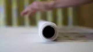 Unrolling Ashley Wilde Alverstone Fabric in Coral