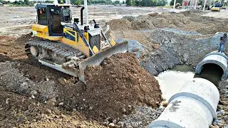 Powerful SHANTUI DH17 C3 Bulldozer Pushing Soil Fill the Sewage system with￼ operator skills ￼