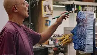 ARTIST: Gil Bruvel painting one of his sculptures