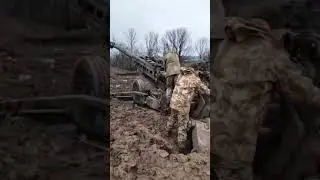 Ukrainian gunners fire a M777A1 howitzer using digital fire-control