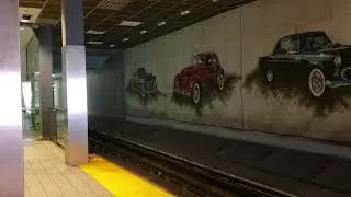 Detroit People Mover arriving at the newly renamed Convention Center Station