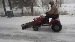 Plowing snow with lawn tractor WITHOUT TIRE CHAINS using 22in. atv tires.