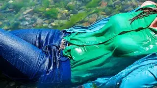 VIDEO FOR YOU! A CUTE GIRL IN WET CLOTHES POSES TENDERLY ON THE BEACH BY THE SEA FOR WETLOOK VIDEO