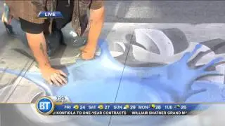 Toronto's Chalkmaster Dave drawing up a storm in Yonge-Dundas Square