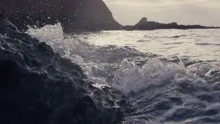 Cinematic huge wave splash against rock, slow motion | Free stock footage