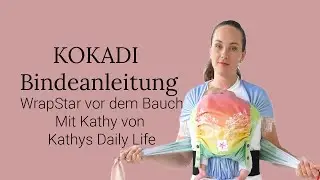 Babytrage Anleitung KOKADI WrapStar vorne auf dem Bauch getragen (Half Buckle / Tragetuchstoff)