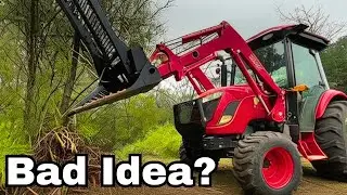 Tree Puller On a Compact Tractor