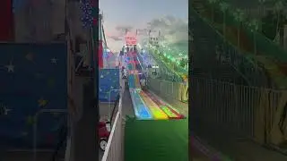 Michigan man goes down a huge fun slide at the Michigan State fair.