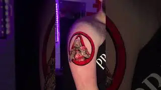 Borderlands 2 style tattoo on upper arm in full colour