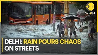 New Delhi: People, cars wade through flooded streets | India | Latest World News | WION