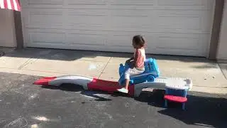 Aria giving away her toy train