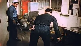 Men park bombs in a passageway on board United States Navy aircraft carrier Boxer HD Stock Footage