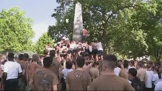 US Naval freshman class complete 'Herndon Monument' plebe climb
