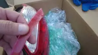 Repair a broken tail light with epoxy and fiberglass.