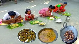 A bangali tribe mother cooking small fish and taro root curry recipe for her family ll village life