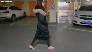 chinese girl mianmian barefoot casual walks in basement