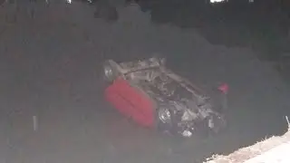 Over speeding car falls in Hussain Sagar | 4 students miraculously escaped with minor injuries
