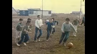Chris and Suzanne in the yard. Soccer game. 1964.