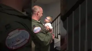 Reagan sees Daddy through glasses for the first time after development