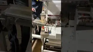 Our Engineer debugging fuel rod visual inspection and shrink wrapping machines at customer's plant