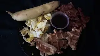 Waffles, bacon, eggs and a banana for breakfast