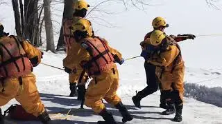 Firefighters doing their ice water rescue training.