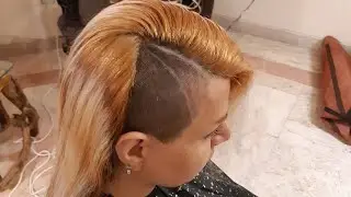 woman sideshave in barbershop by man