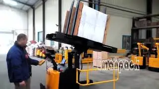 Fork type pallet rotator used to flip piles of printed paper