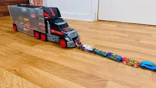 23 tomica mini cars bening transported by transporter truck