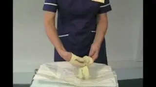 Putting on sterile gloves