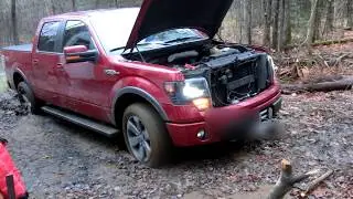 F-150 with old Pirelli tires in mud