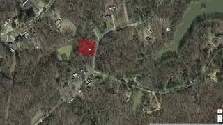 Paved Road in the front, Pond at back of your lot - come see